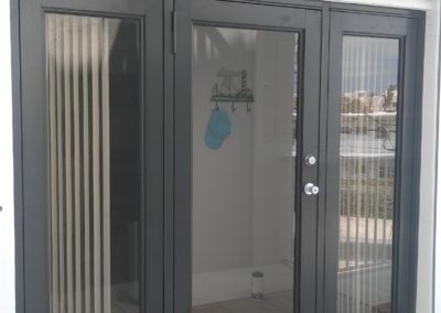 Backyard impact doors with gray frames