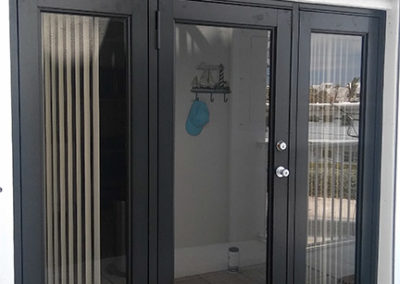 Backyard impact doors with gray frames