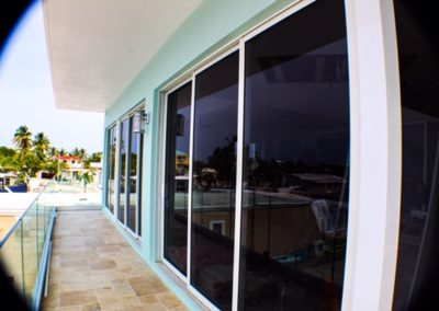 Tinted Impact windows on a 2 floor house